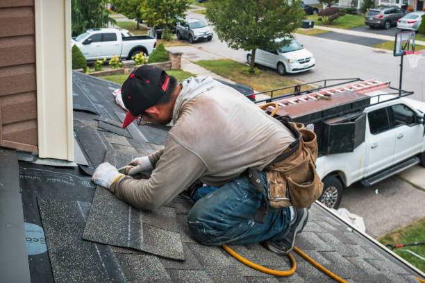 Professional Roofing technician working in Burton, MI